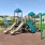playground with green grass around it