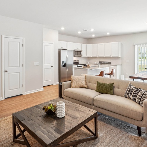Beautiful living areas to match your lifestyle Furnished Easthaven townhome living room with a couch and coffee table