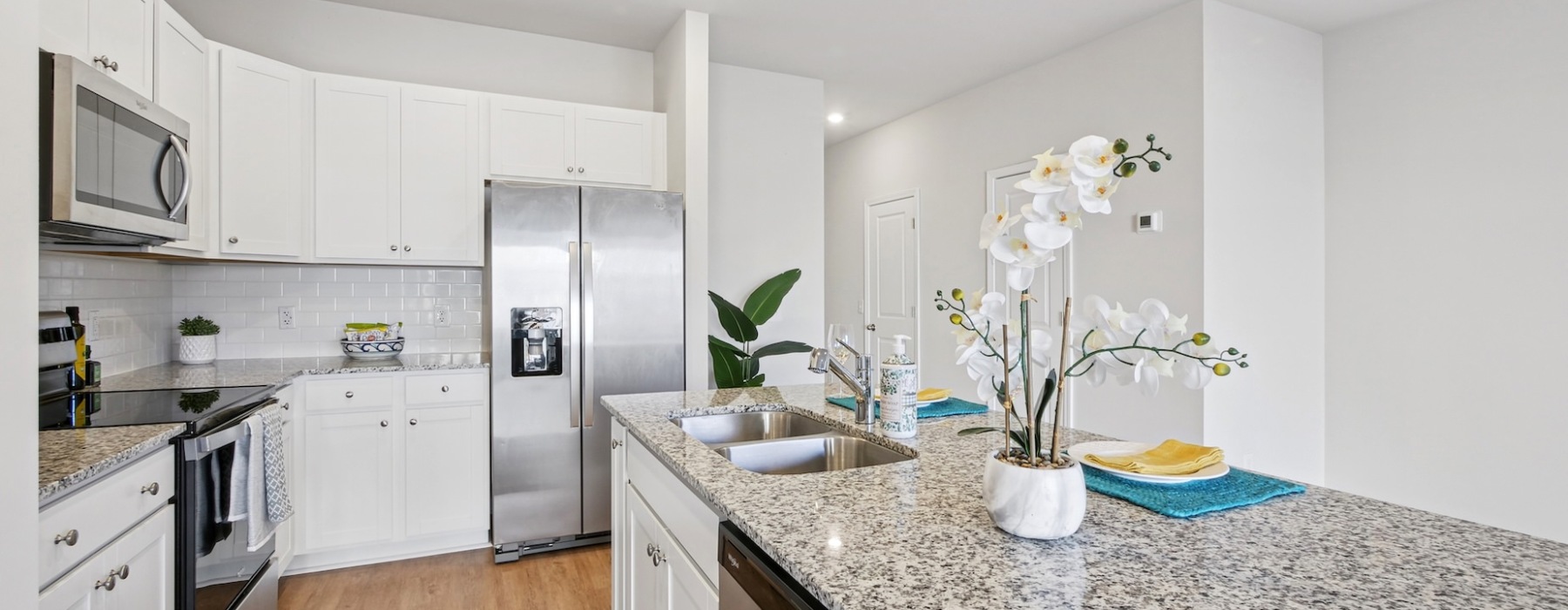 Granite countertops and stainless steel appliances inside townhome kitchens at Easthaven 